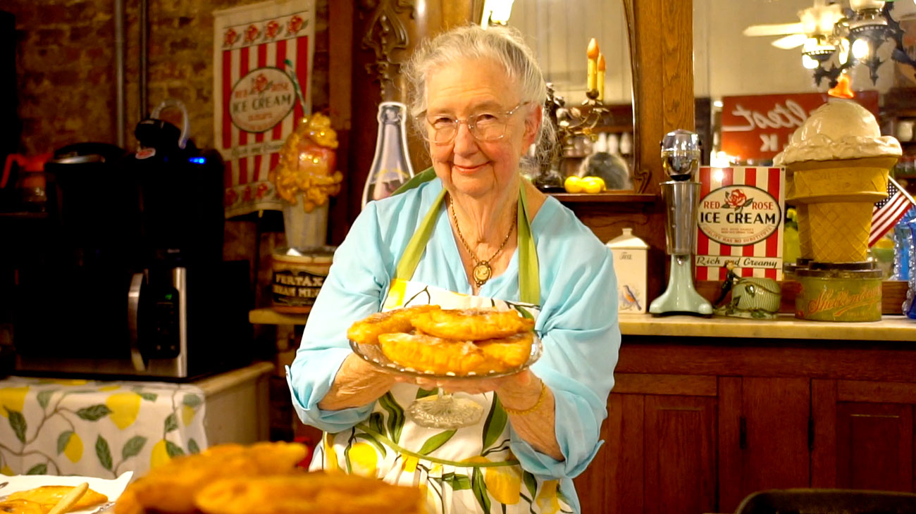 Woman Serving Bell Buckle Pies